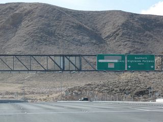 After the Interstate 15 interchange, an overhead sign points the way to Southern Highlands Parkway north, which serves a new residential community on the west side of Interstate 15 north of St. Rose Parkway. North of Cactus Avenue, Southern Highlands Parkway changes into Decatur Boulevard northbound.
