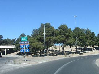 Nevada 147 (Lake Mead Boulevard) west at Interstate 15 south to the Strip and north to Mesquite and Salt Lake City, Utah.