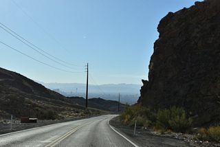 SR 147 (Lake Mead Boulevard) lowers between Frenchman and Sunrise Mountains to Las Vegas Valley.