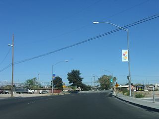 Westbound Nevada 147 (Lake Mead Boulevard) splits into two carriageways briefly before intersecting the Interstate 15 freeway, hence the curve to the right after the overhead sign seen in the previous photo.
