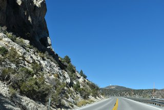 Angel Peak (8,881 feet) rises in the distance as SR 158 (Deer Creek Road) advances northerly through the Spring Mountains.  