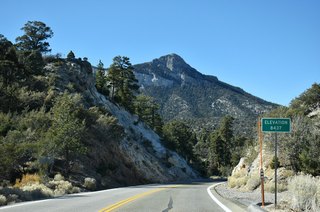 SR 158 north reaches its highest point at 8,437 feet west of Angel Peak Road.