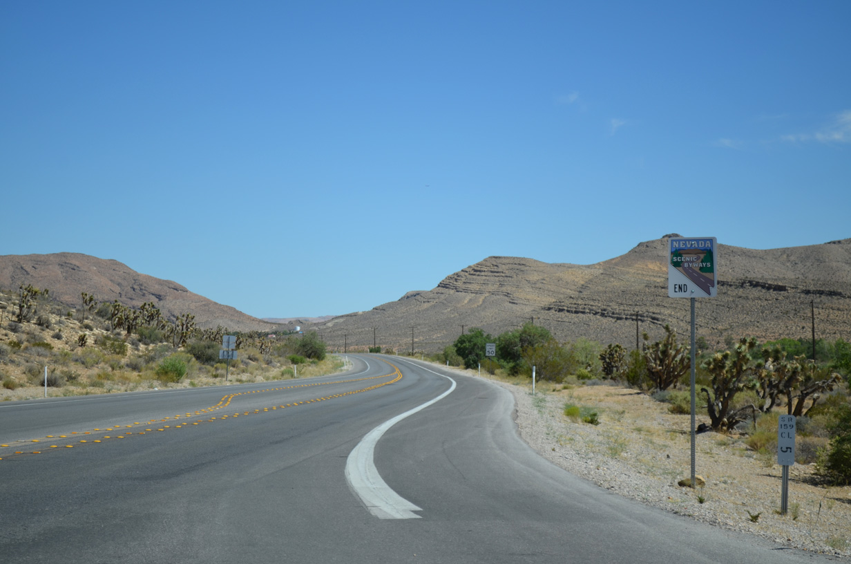 Milepost 5 for SR 159 and an end Nevada Scenic Byway sign stand just south of Bonnie Springs Road.