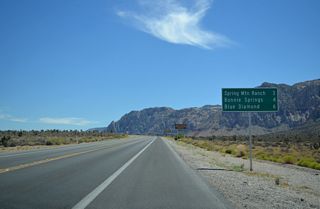 The Red Rocks Canyon National Conservation Area Scenic Loop returns to SR 159 ahead of this distance sign six miles from Blue Diamond.