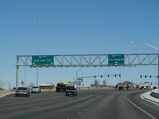 The original northbound entrance ramp to I-15 was realigned onto a collector distributor roadway extending north to the Fish Bowl interchange with I-215 and Clark County Route 215 (Bruce Woodbury Beltway).