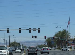 Windmill Lane extends 2.1 miles east from SR 160 (Blue Diamond Road) to a SPUI with Interstate 215.