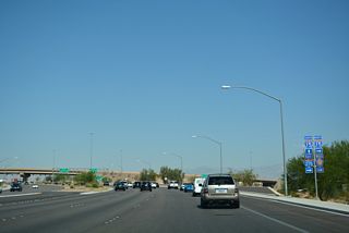 A previous shield assembly referenced the nearby Fishbowl interchange joining I-15 north with CC-215 west and I-215 east with trailblazers for the Bruce Woodbury Beltway.