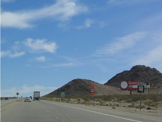 Eastbound Nevada 163 begins near Cal-Nev-Ari as a divided highway after U.S. 95. Nevada 163 crests, then descends into the Colorado River Valley and Laughlin.