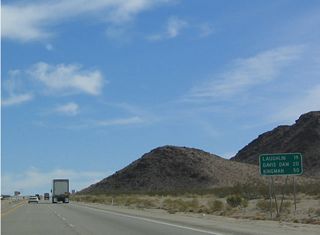 This mileage sign along eastbound Nevada 163 provides the distance to Laughlin, Davis Dam, and Kingman, Arizona, via Arizona 95 and Arizona 68.