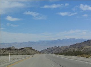 Nevada 163 provides some breathtaking views of the Lake Mead National Recreation Area, the Black Mountains, Black Canyon, Laughlin, and the Colorado River as it is descends toward the river. The highway retains four lanes, but the median barrier is eliminated on several turns.