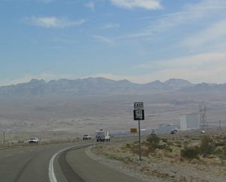 The tall buildings that make up the skyline of Laughlin are all hotels and casinos; many of them front the Colorado River directly. Note the power line, which has paralleled Nevada 163 since parting ways from U.S. 95. This line heads to Davis Dam.