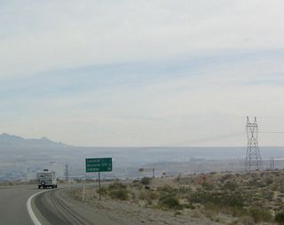 This photo again shows the power line that connects to Davis Dam as well the mileage sign to Laughlin, Bullhead City, and Kingman (the latter two destinations are in Arizona and are reached by Arizona 95 and Arizona 68, respectively).