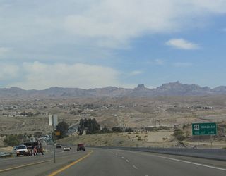 As eastbound Nevada 163 approaches Laughlin (which is not an incorporated city, just a town under the jurisdiction of Clark County), signs appear for connections into Arizona via Arizona 68 to Kingman and Arizona 95 to Bullhead City.