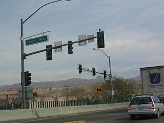View of the traffic signal with Casino Drive as seen along eastbound Nevada 163 in Laughlin. Nevada 163 comes to its end as it crosses the Laughlin Bridge (constructed in 1987). Prior to the completion of the bridge, traffic used Davis Dam (the dam is not open for vehicle crossings as of 2006).