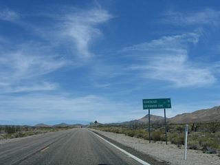 This mileage sign provides the distance to Searchlight (U.S. 95, 18 miles) and Cottonwood Cove at Lake Mohave (within the larger Lake Mead National Recreation Area, 32 miles).