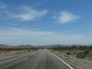 Continuing east, Nevada 164 sees fewer Joshua trees and more sagebrush. In the distance is the community of Searchlight and the junction with U.S. 95.