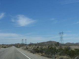 Advancing toward the limits of Searchlight, a second 500kV power line (likely owned by Southern California Edison), which is also part of Path 46, connects the Mohave Generation Station near Laughlin to the southeast and Eldorado Substation to the north. Companion 230kV power lines also follow this power corridor.