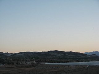 Curving south from Butte Wash, the exclusive Lake Las Vegas development comes into view, including the lake and the various residences and condominiums that surround it.
