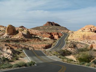 Mouse's Tank Road spurs north from the Visitors Center to scenic views of the painted desert and more red rock formations.