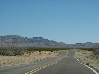 The highway generally follows the lay of the land, so dips and rises are common along this section of the route. Arizona crossings, which may flood during periods of heavy rain (or floodwaters from areas uphill from here), are also fairly common.