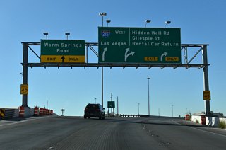 A loop ramp joins the south end of the Airport Connector with a separate ramp from I-215 east for Warm Springs Road.