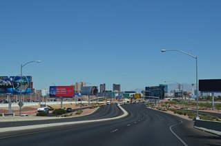 Various advertisement boards line Paradise Road (Airport Connector) where it passes east of Terminal 1.