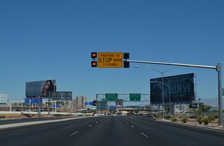 The limited-access portion of Paradise Road (Airport Connector) ends at the ensuing traffic signal with Russell Road.
