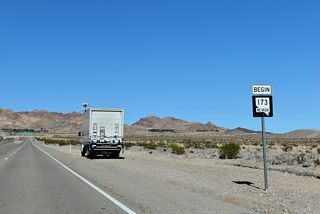 The begin SR 173 shield assembly stands just north of the parclo interchange (Exit 14) where U.S. 95 combines with I-11/U.S. 93.