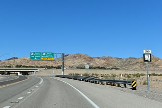 The north end shield for SR 173 precedes the entrance ramp for U.S. 93 Business southbound.