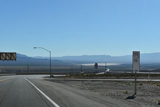Milepost 1 for SR 173 stands within the diamond interchange joining Veterans Memorial Parkway with U.S. 93 Business (Boulder City Parkway).