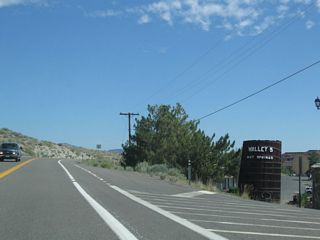 A large barrel welcomes visitors to David Walleys Hot Springs. For a fee, visitors may soak in the hot springs that give Walleys Hot Springs its name. Additionally, the facility a spa for weary travelers.
