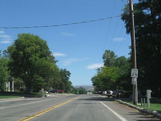 Until 1996, Nevada 206 continued north of Genoa Lane along Jacks Valley Road. When Jacks Valley Road was relinguished to Douglas County, Nevada 206 was rerouted onto Genoa Lane east of the town of Genoa. This view looks north on Jacks Valley Road in Genoa after the Genoa Lane intersection.