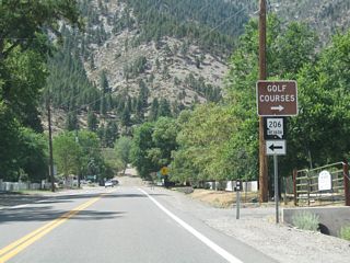 Westbound Nevada 206 (Genoa Lane) meets Jacks Valley Road at a stop sign.