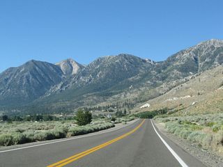 The state route follows Foothill Road and stays close to the edge of the Carson Range, which towers over the valley on the west side.