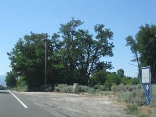 A roadside historical marker welcomes motorists to the site of Sheridan.