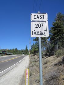 Upon leaving the U.S. 50 intersection in the unincorporated community of Kingsbury, a begin Nevada 207 east shield is posted. From here, it is all uphill to Daggett Pass.
