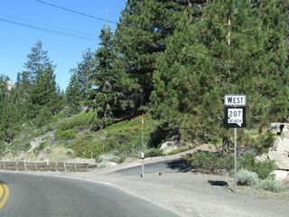 Nevada 207 (Kingsbury Grade) lowers from Daggett Pass, Tahoe Ridge, and Heavenly North toward Lake Tahoe.