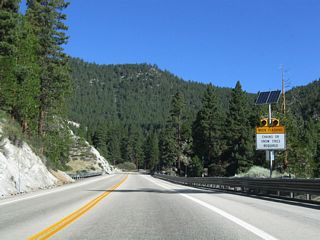SR 207 navigates through two 180 degree curves northward around Pine Basin.