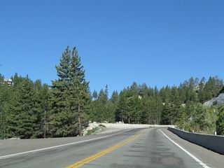 Ascending past 7,000 feet above sea level, Nevada 207 (Kingsbury Grade) advances to Heavenly North and Tahoe Ridge. A turnoff to the resort development lies ahead.