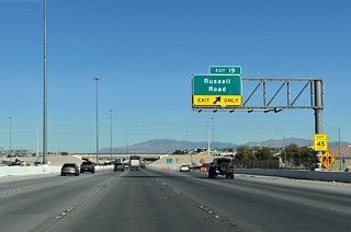 Exit 19 joins CC-215 (Bruce Woodbury Beltway) to Russell Road. Locally, Russell Road extends west to Hualapai Way and east to Buffalo Drive.