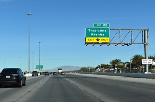 Clark County Route 215 advances from Russell Road to meet Tropicana Avenue next at Exit 20.