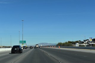 The Bruce Woodbury Beltway follows an S-curve through the exchange (Exit 20) with Tropicana Avenue. A single point urban interchange (SPUI) joins the freeway with Town Center Drive in three miles.