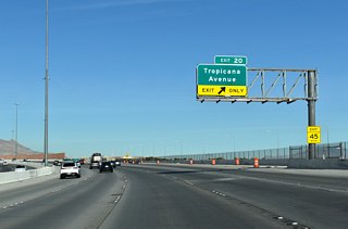 A slip ramp departs CC-215 north at Exit 20 for Brent Thurman Way to Tropicana Avenue. Tropicana Avenue connects the western suburbs with the Strip, Harry Reid International Airport (LAS), and the University of Nevada at Las Vegas (UNLV). 