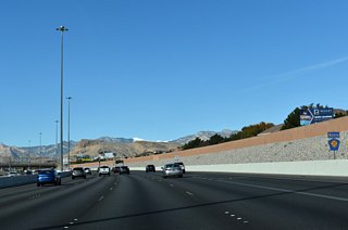 CC-215 angles northwest to Town Center Drive next, passing under Hualapai Way en route.