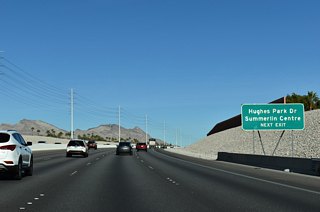 Hughes Park Drive forms a frontage road system along the beltway, connecting Sahara Avenue with Charleston Boulevard (SR 159) at Exit 26.