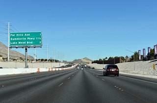 Advancing north from SR 159, the Bruce Woodbury Beltway next meets Far Hills Avenue ahead of SR 613 (Summerlin Parkway).