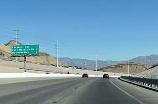 The Las Vegas Beltway turns eastward to meet Hualapai Way at Exit 35 in six miles. Lone Mountain Road meets Clark County Route 215 at a diamond interchange (Exit 32) in three miles. 