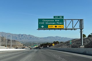 Bordering Sun City Summerlin to the north, Cheyenne Avenue is an arterial leading east through Las Vegas. Cliff Shadows Parkway continues north from upcoming Exit 30 to Lone Mountain Road.