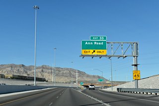 A lane drop occurs along CC-215 northbound at Exit 33 for Ann Road.