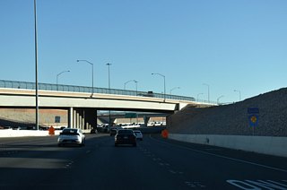 Fort Apache Road passes over the Bruce Woodbury Beltway ahead of Exit 20 to Tropicana Avenue.